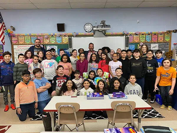 Rob Levine with a classroom full of kids