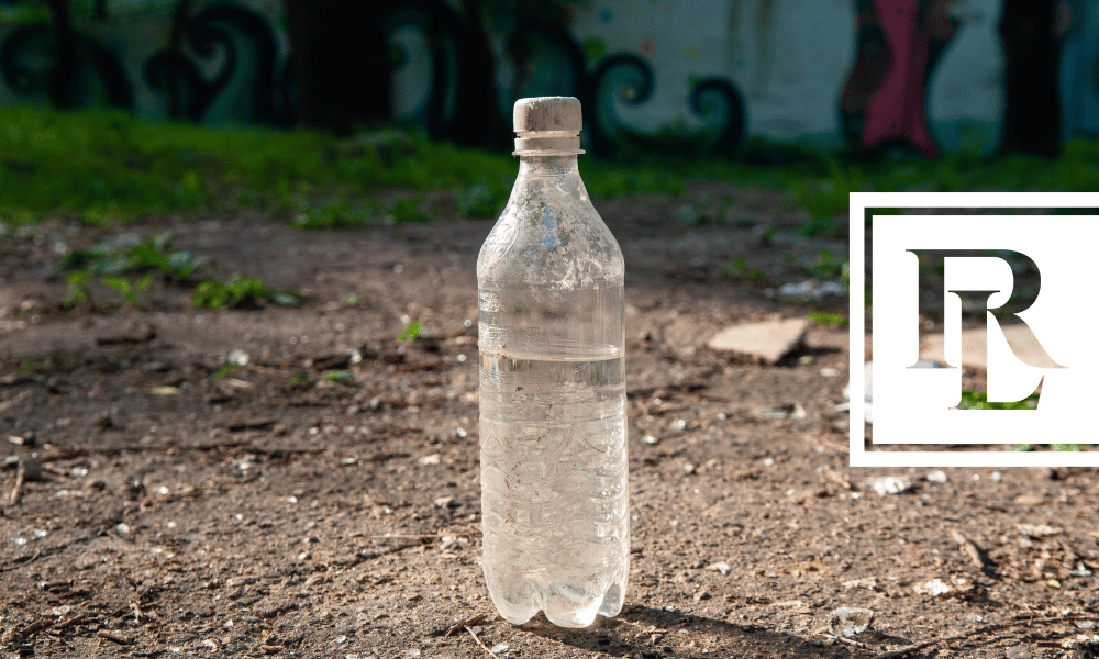 Water bottle on dirt ground