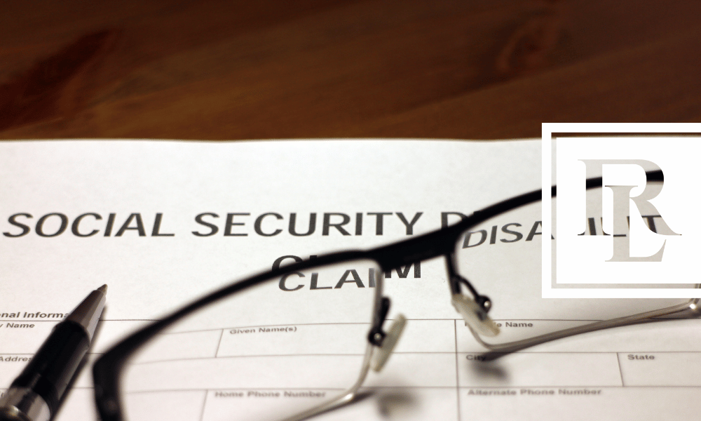 Social Security Claim paperwork on table with glasses placed on top of it