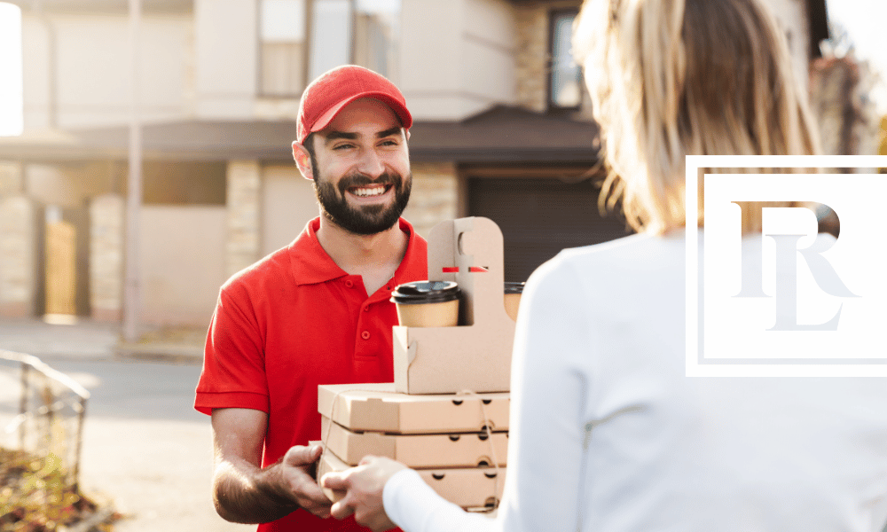 Man handing food delivery to a woman