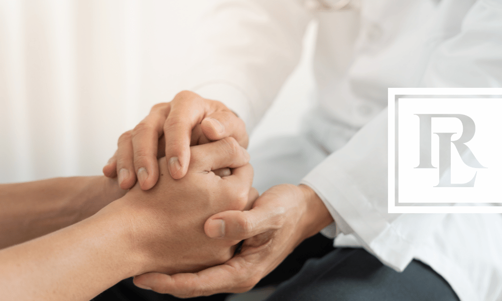 Closeup of doctor holding a patient's hands