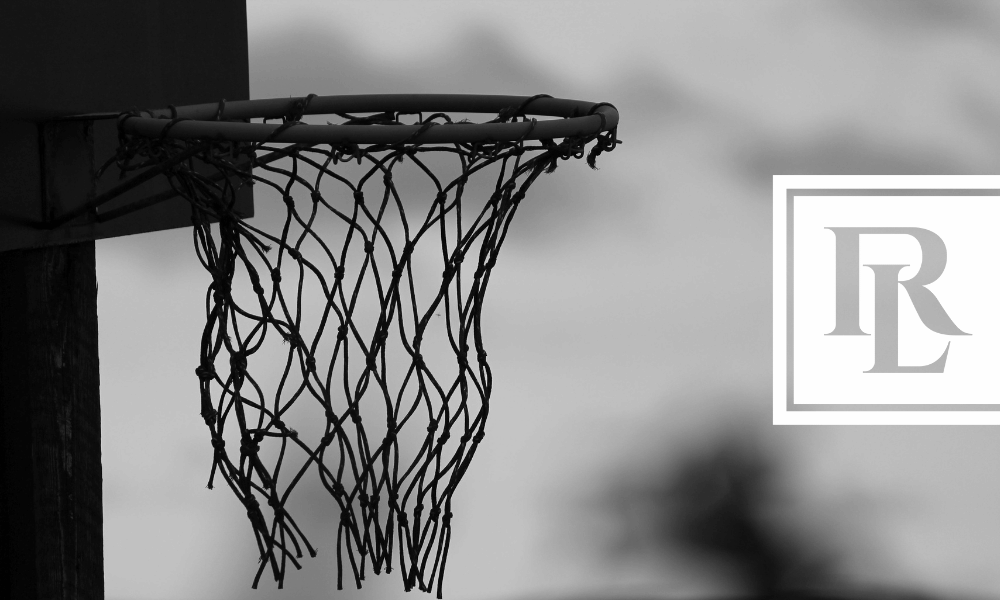 Black and white closeup photo of basketball net