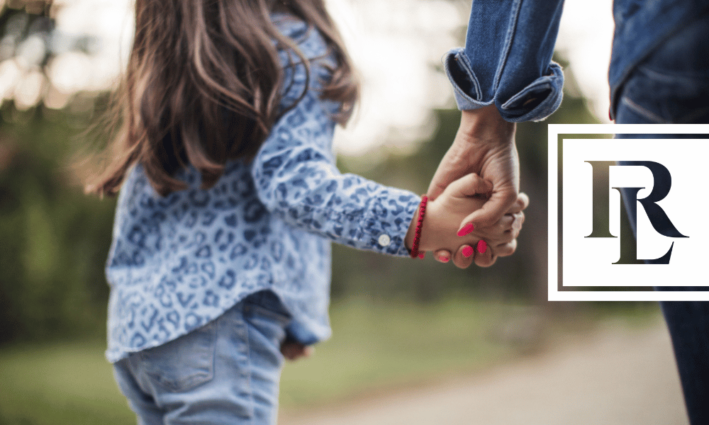 Woman holding little girl's hand