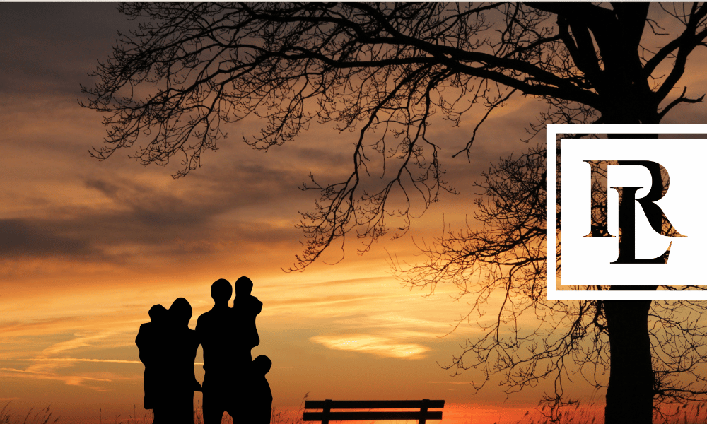 Family outside looking at the sunset